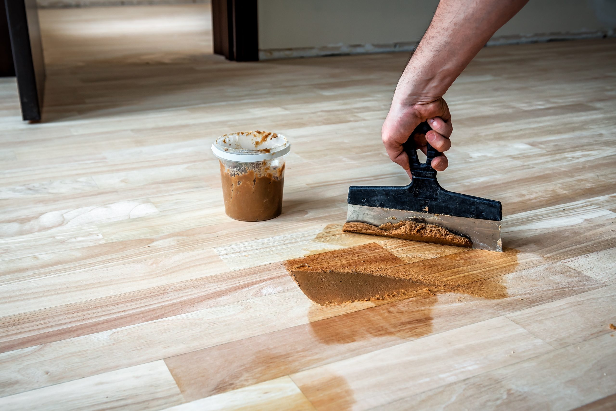 Hardwood Floor Refinishing in Walthamstow with gap filling on a maple hardwood strip floor during the restoration process